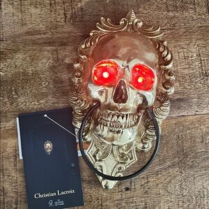 Christian Lacroix Gold Skull Wall Accent with Red LED Eyes door knocker